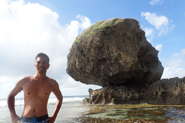  Behind me is the big rock from which the name Magpupungko came from.  It appears to be sitting on another rock formation. Pungko means squatting or sitting in the local dialect. 